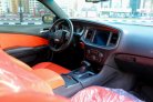 Orange Dodge Challenger V6 2019 for rent in Sharjah 9