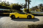 Yellow Lamborghini Huracan Evo Spyder 2022 for rent in Dubai 3