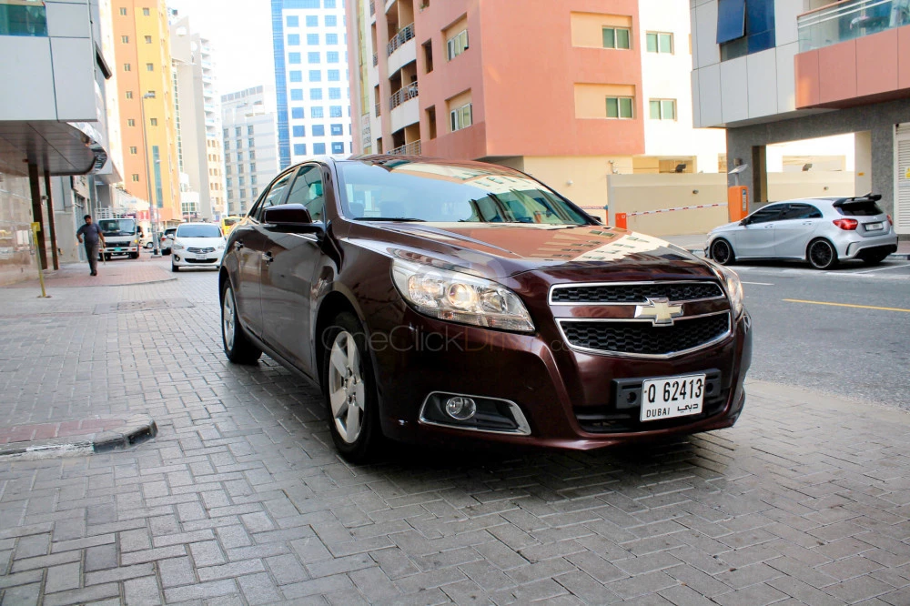 Maroon Chevrolet Malibu 2015 for rent in Dubai 1