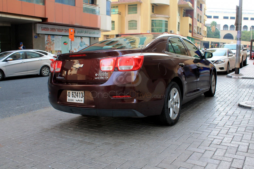 Maroon Chevrolet Malibu 2015 for rent in Dubai 6