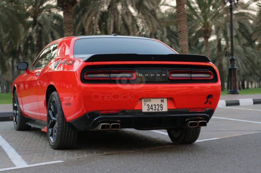 Orange Dodge Challenger V6 2019 for rent in Sharjah 6