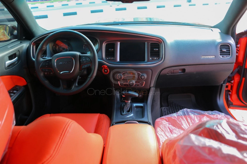 Orange Dodge Challenger V6 2019 for rent in Sharjah 10