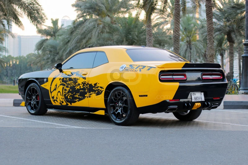 Yellow Dodge Challenger V6 2018 for rent in Dubai 9
