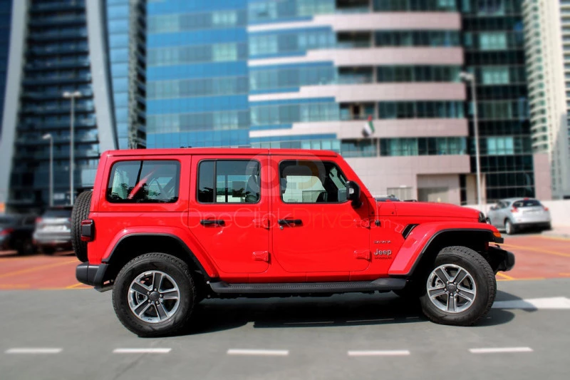 rouge Jeep Wrangler Unlimited Sahara Edition 2019 for rent in Dubaï 2
